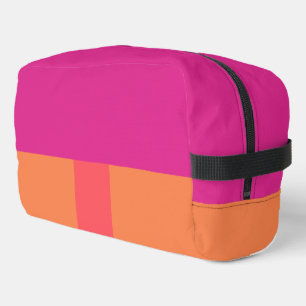 Farbblöcke in heiß rosa und orange waschbeutel