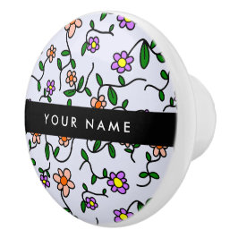 Farbenfrohe Blume, blauer Hintergrund, schwarz Keramikknauf