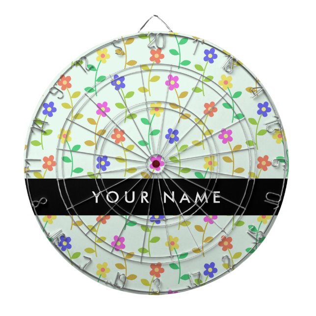 Farbenfrohe Blume, hellgrüner Hintergrund, schwarz Dartscheibe (vorne)