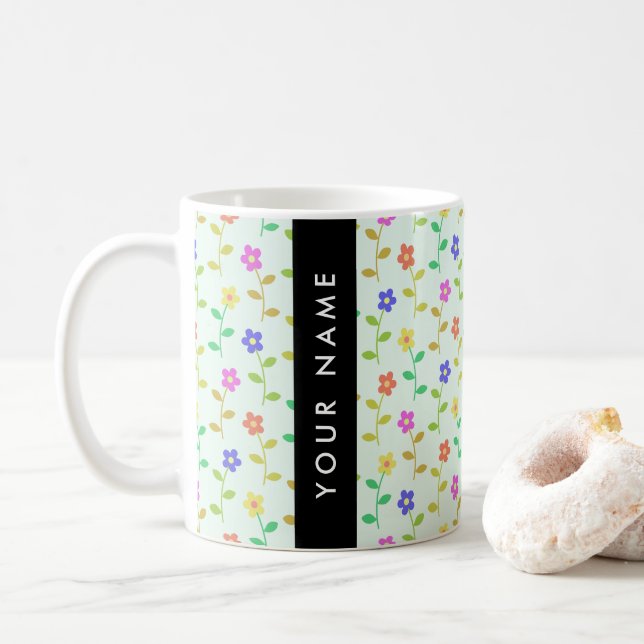 Farbenfrohe Blume, hellgrüner Hintergrund, schwarz Kaffeetasse (Mit Donut)