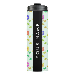 Farbenfrohe Blume, hellgrüner Hintergrund, schwarz Thermosbecher