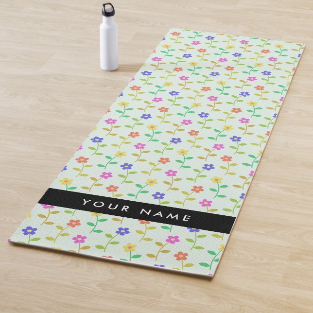 Farbenfrohe Blume, hellgrüner Hintergrund, schwarz Yogamatte (Beispiel)
