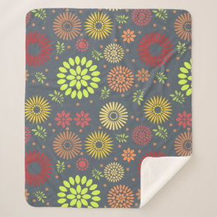 Farbenfrohe Blume in warmen Farbtönen Sherpadecke