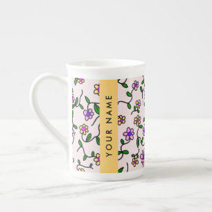 Farbenfrohe Blumen, rosa Hintergrund, gelb Prozellantasse