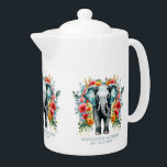 Farbenfrohe Blumengestelle<br><div class="desc">Grauer Elefant mit farbenfrohen Dekorationen der Blume.</div>