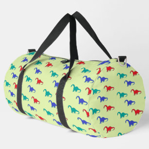 Farbenfrohe Dinosaurier-Muster auf grün Duffle Bag