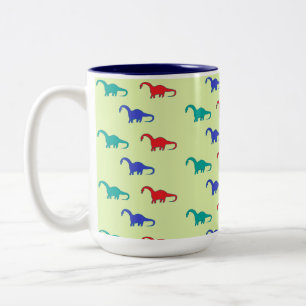 Farbenfrohe Dinosaurier-Muster auf grün Zweifarbige Tasse