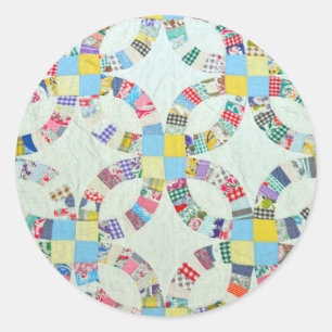 Farbenfrohe Patchwork-Steppdecke Runder Aufkleber