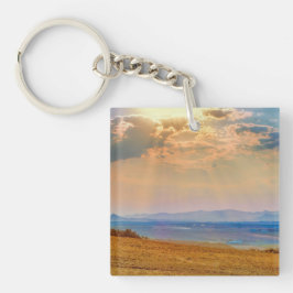 Farbenfrohe Sonnenuntergänge über den zentralen Bo Schlüsselanhänger