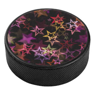 Farbenfrohe Sterne tanzen whimsisisch Eishockey Puck