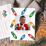 Farbenfrohe Weihnachtsbeleuchtung Foto Feiertagspostkarte<br><div class="desc">Freuen Sie sich auf die festliche Ferien-Postkarte mit einem fröhlichen Design der Weihnachtsleuchten in Aquarellen in Rot, Grün, Blau und Orange. Ein viereckiges Foto auf der Vorderseite wird durch diese lebhaften Lichter auf einem hellen, weißen Hintergrund gerahmt, mit eigenem Gruß und Familienname in fett roten Buchstaben dargestellt. Mit seinem farbenfrohen,...</div>