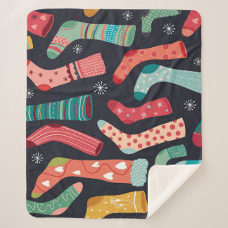 Farbenfrohe Wintersocken, nahtloses Muster. Sherpadecke