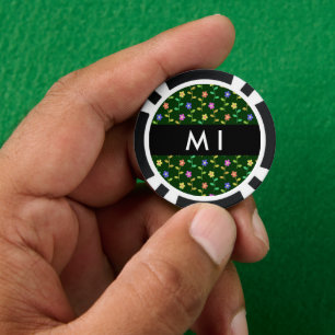 Farbige Blume, grüner Hintergrund, schwarz Pokerchips