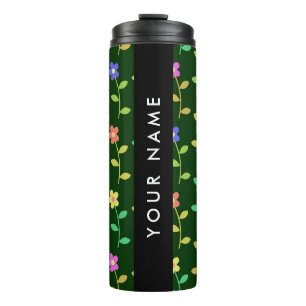 Farbige Blume, grüner Hintergrund, schwarz Thermosbecher
