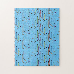 Farbige Hockeyschläger mit blauem Hintergrund Puzzle