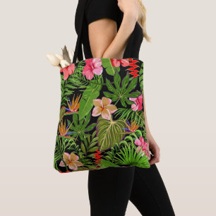 Farbige tropische Blätter und Hibiskusblüten