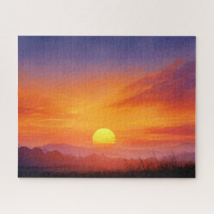 Farbiger Sonnenuntergangs-Himmel und Bergfotografi Puzzle