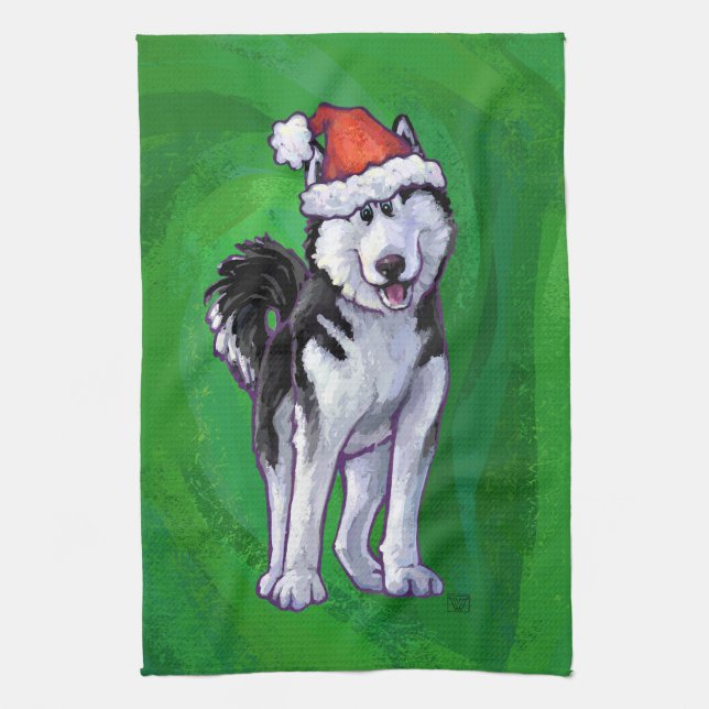 Feiernder Husky in Weihnachtsmannmütze auf Green Geschirrtuch (Vertikal)