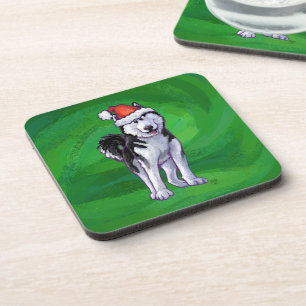 Feiernder Husky in Weihnachtsmannmütze auf Green Untersetzer