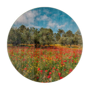 Feld mit Blume und Bäumen Schneidebrett