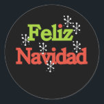 Feliz Navidad Merry Christmas Runder Aufkleber<br><div class="desc">Roter und grüner Text mit weißen Schneeflocken lautet "Feliz Navidad" auf den Urlaubskarten,  Tasse,  Taschen,  Tasten,  T - Shirt und vielem mehr.</div>