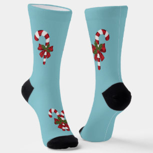Festliche rote und weiße Candy Canes auf Hellblau Socken