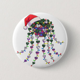 Festliche tropische Zimmerpflanze mit Weihnachtsma Button