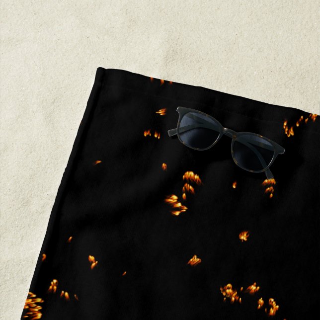 Feuerbrand überlagert das Foto, das die schwarzen  Strandtuch (Beispiel)