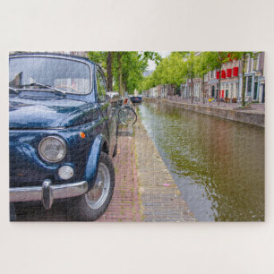 Fiat 500 Auto auf einem Kanal in Amsterdam Puzzle