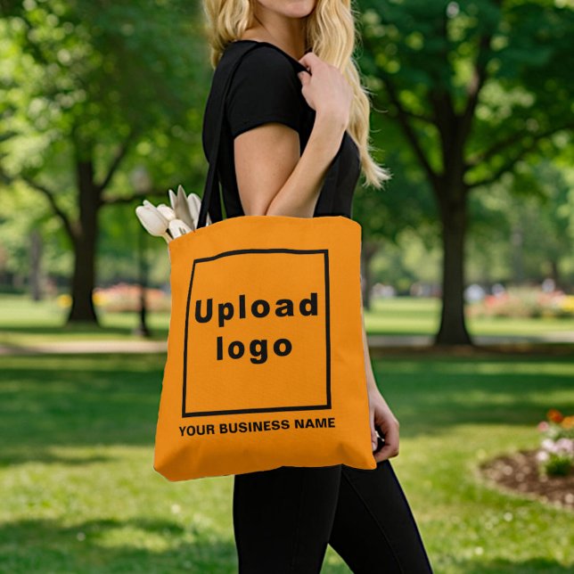 Firmenname und Logo auf der Orange Tote Bag (Orange tote bag with customization options: type your business name and upload your business logo.)
