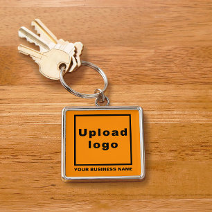 Firmenname und Logo auf Orange Square Premium Schlüsselanhänger