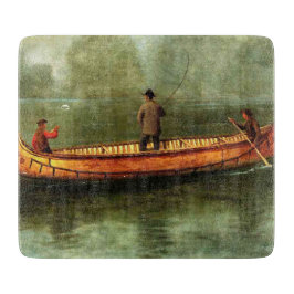 Fischerei von einem Kanu (Fischer in einem Holzboo Schneidebrett