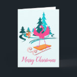 Flamingo Christmas Winter Wonderland Karte<br><div class="desc">Flamingo's Flocking Fabelhafte Weihnachts Winter Wonderland Funny Holiday Grußkarte. Niedlicher Flamingo mit einem Schlitten durch eine schneebedeckte Winterlandschaft mit einem anstrengenden Rentier! Ideal für Flamingo-Liebhaber,  die Frohe Festtage aus Florida und Stränden überall schicken.</div>