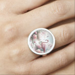 Flamingo in Pastel Pond Floral Scene Ring<br><div class="desc">Immerse yourself in a tranquil dreamscape with this elegant flamingo art, where soft pink feathers meet lush botanical beauty. Surrounded by blooming peonies, lotus pads, and pampas grasses, a graceful flamingo stands poised at the water’s edge under a pastel sky. This pink floral illustration merges tropical bird decor with the...</div>