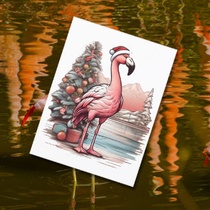 Flamingo mit Weihnachtsmannmütze neben Weihnachtsb Postkarte