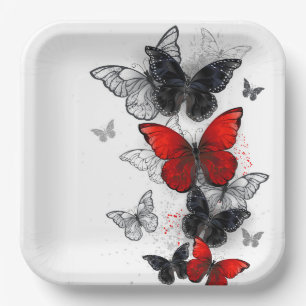 Fliegende schwarze und rote Morpho-Schmetterlinge Pappteller