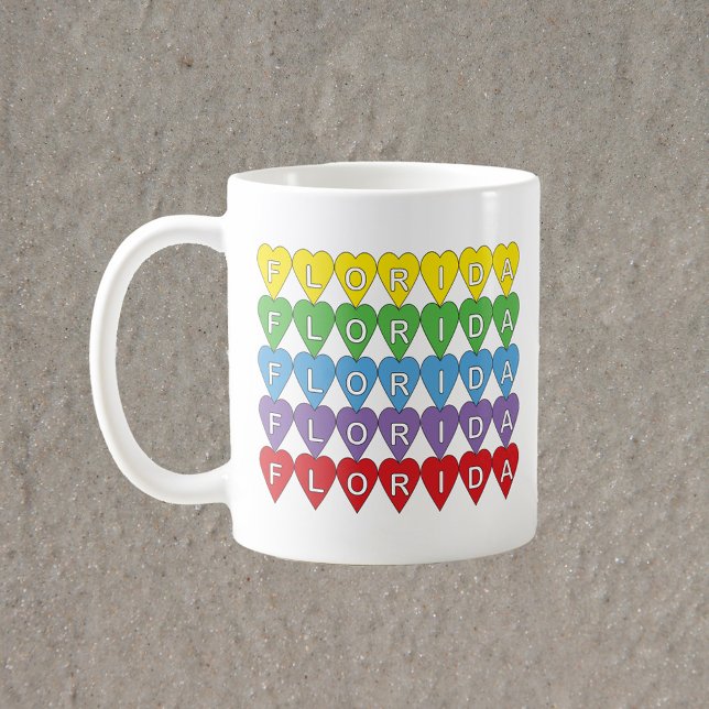 Florida Regenbogenherzen Kaffeetasse (A mug that says Florida in red, yellow, green, blue & purple hearts.)