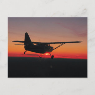 Flug in den Sonnenuntergang Postkarte