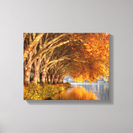 Flugzeug im Herbst über einem See Leinwanddruck