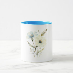 Flüsternde Blütenblätter: Sanfte blaue und cremefa Tasse