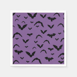 Flying bats on purple serviette
