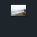 Foggy Scarborough Beach Leinwanddruck<br><div class="desc">Immerse yourself in the serene, misty beauty of Scarborough's coastline on a foggy day. This atmospheric image captures the calm waves of the North Sea gently rolling onto the unique brick-patterned beach, with the iconic Scarborough hills fading into the distance. Perfect for those who appreciate the moody charm of coastal...</div>