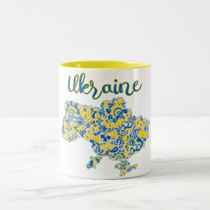 Folklorisches Muster und ukrainische Typografie Zweifarbige Tasse