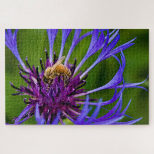 Foto einer wunderschönen lila Blume mit Honigbiene Puzzle