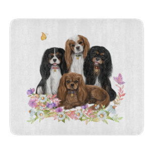 Four Cavalier King Charles Spaniels in Blume   Schneidebrett