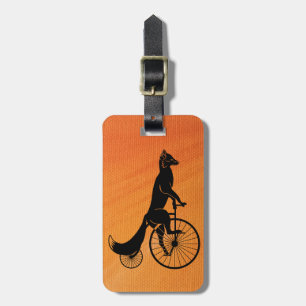 Fox, der eine Fahrrad-Silhouette im Schwarzen Gepäckanhänger