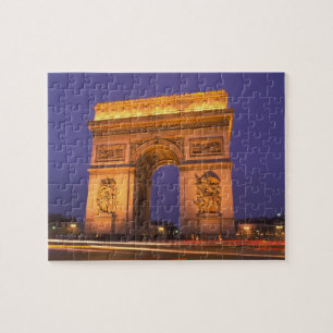 Frankreich, Paris, Arc de Triomphe in der Nacht. Puzzle