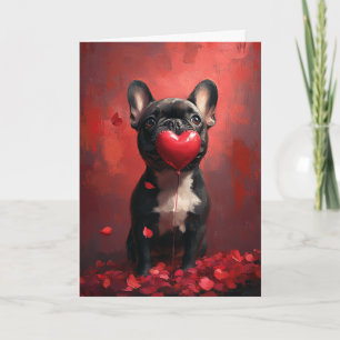 Französische Bulldogge hält Herzballon zum Valenti Karte