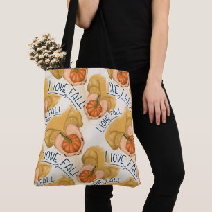 FRAU IN GOLD SWEATER HOLDING TINY PUMPKIN