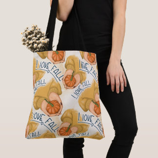 FRAU IN GOLD SWEATER HOLDING TINY PUMPKIN